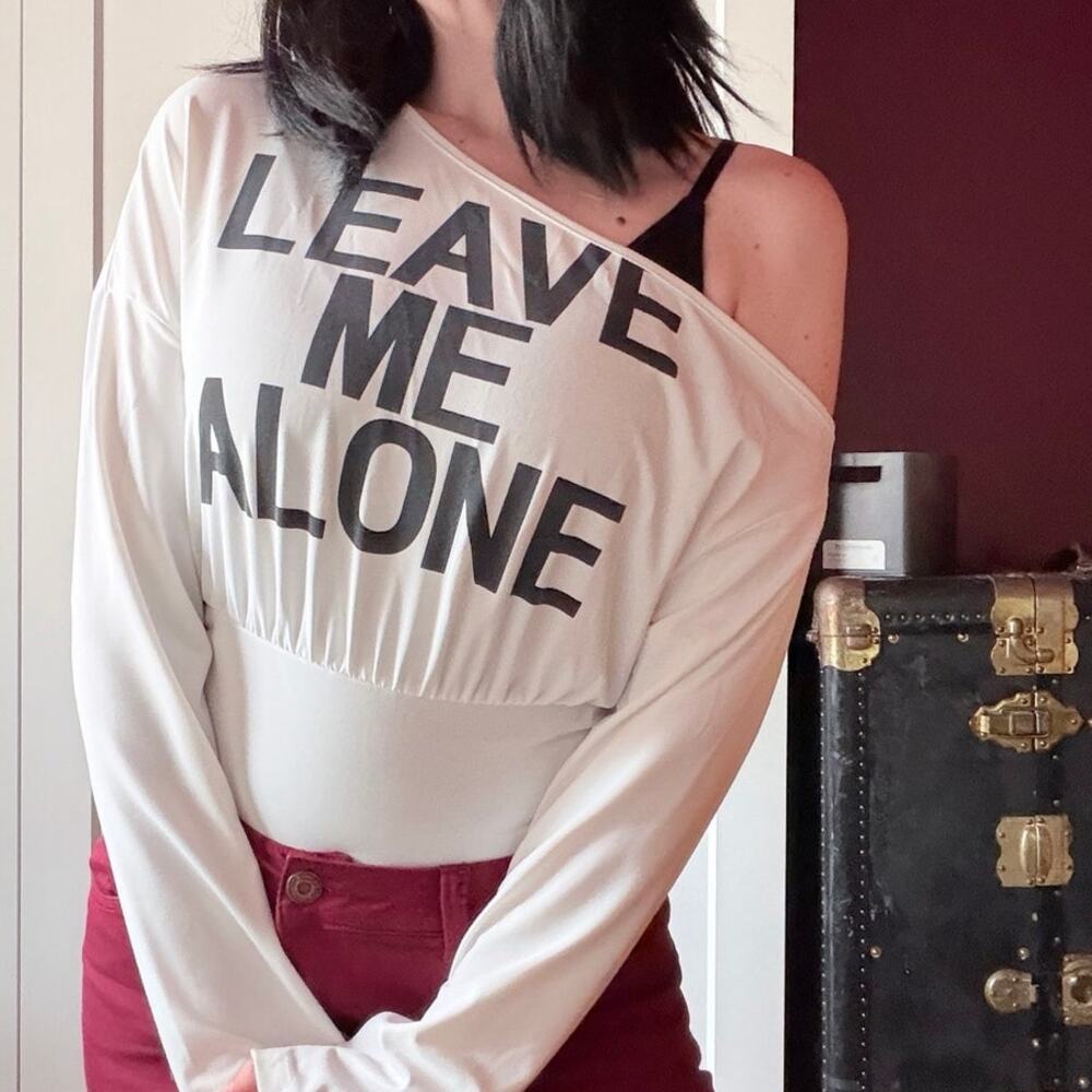 leave me alone off the shoulder graphic top